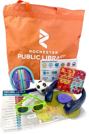 RPL youth sensory kit which includes an orange bag, headphones, sunglasses, a decibel map, fidget toys, and neck cooling device.