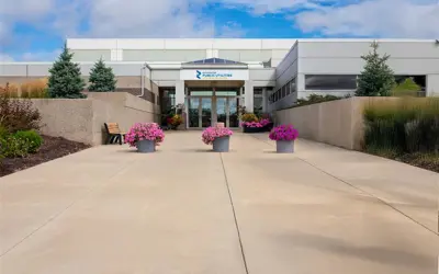 exterior view of Rochester Public Utilities service center on a partly cloudy day